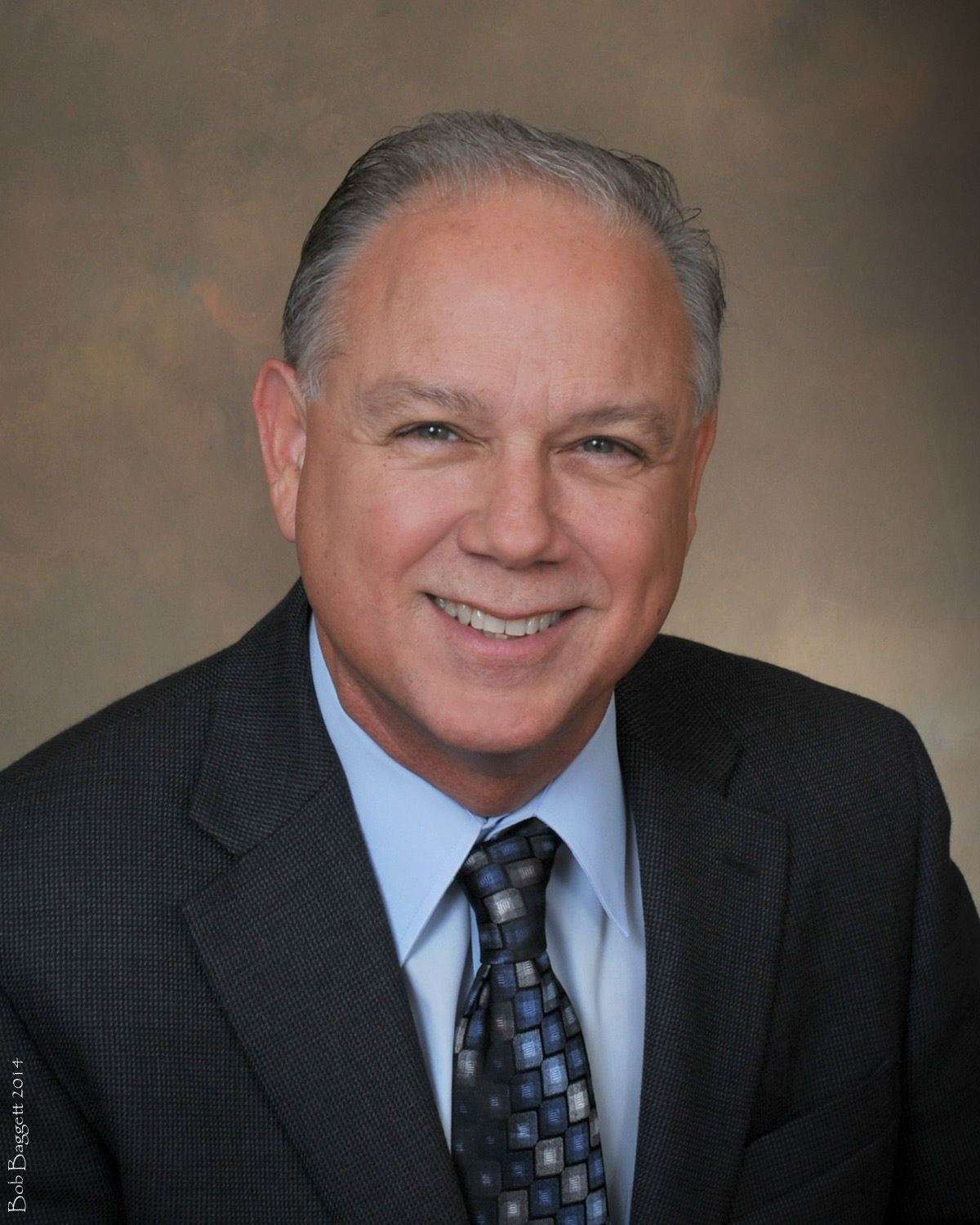 LinkedIn headshot — corporate professional photographed by Bob Baggett